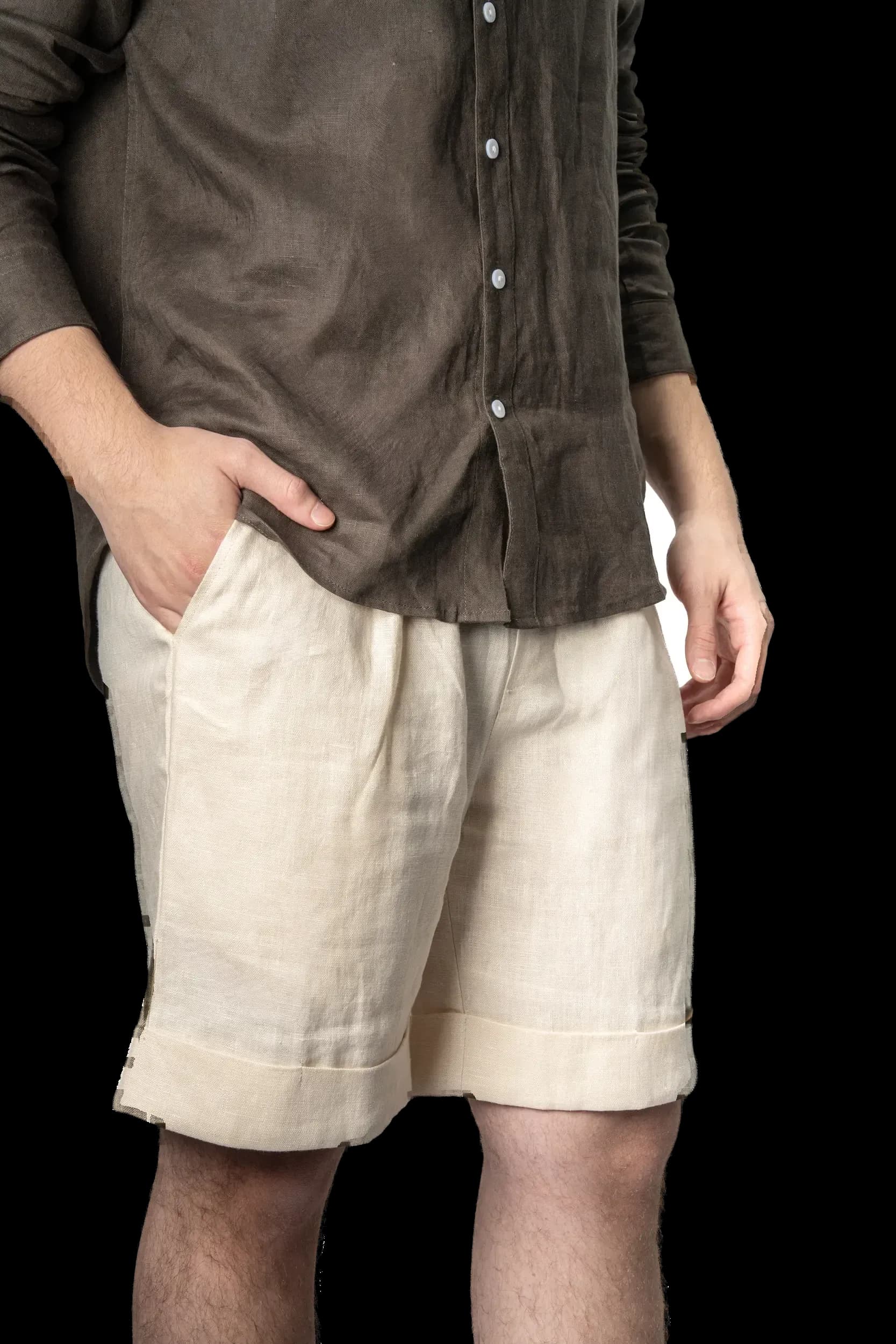 Model: olive shirt with beige shorts, hand in pocket